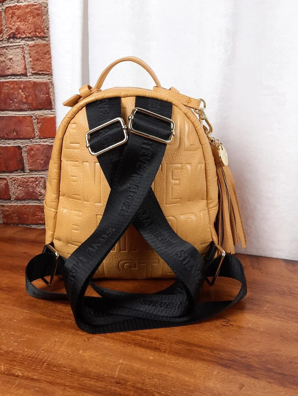 Steve Madden Mustard Mini Tassel Backpack